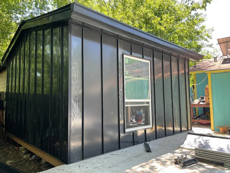 Black standing seam metal wall panels for Roof Inspection in Barnesville